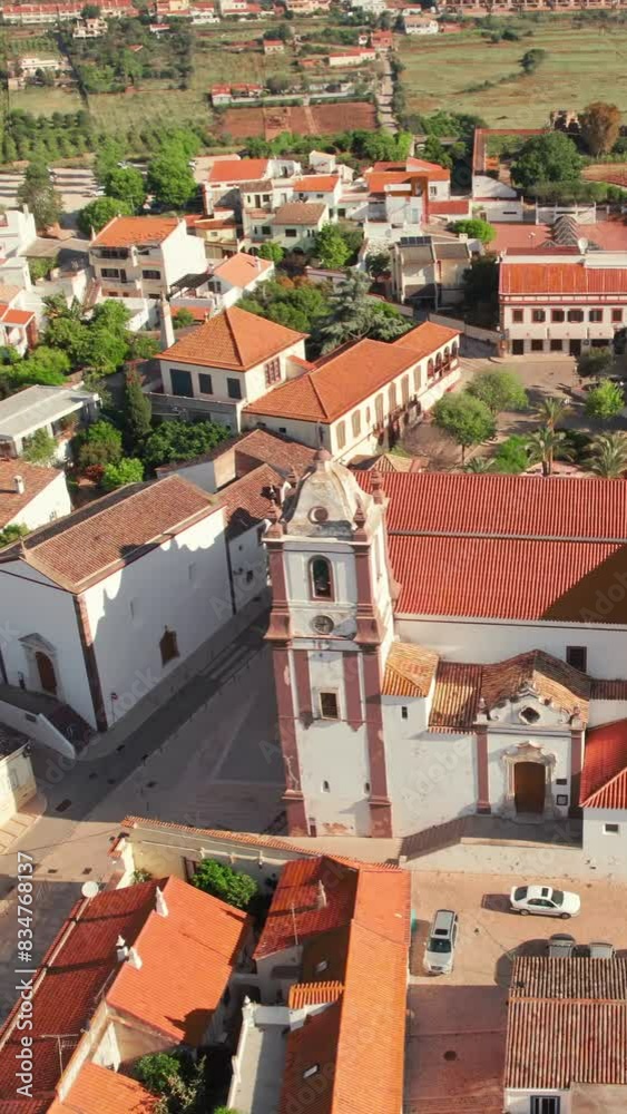 Aerial view of Silves town with famous medieval castle and Cathedral, Algarve region, Portugal. Flying over Silves Cathedral church and historic fortress. Orbit shot Aerial view of Silves town with famous medieval castle and Cathedral, Algarve region, Portugal. Flying over Silves Cathedral church and historic fortress. Orbit shot