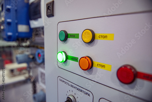 Pushbuttons and switches on the control panel of industrial equipment. Selective focus. photo