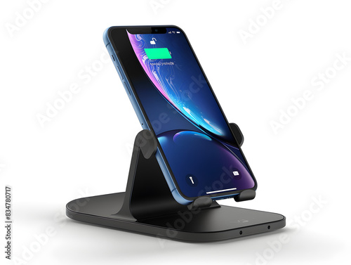 A sleek black charging stand with a wirelessly connected smartphone charging on top. photo