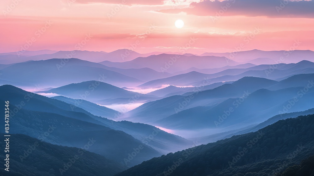 Fototapeta premium A panoramic view of the Blue Ridge Mountains at sunrise, the sky painted in soft shades of pink and orange, highlighting the misty valleys between the layered hills.