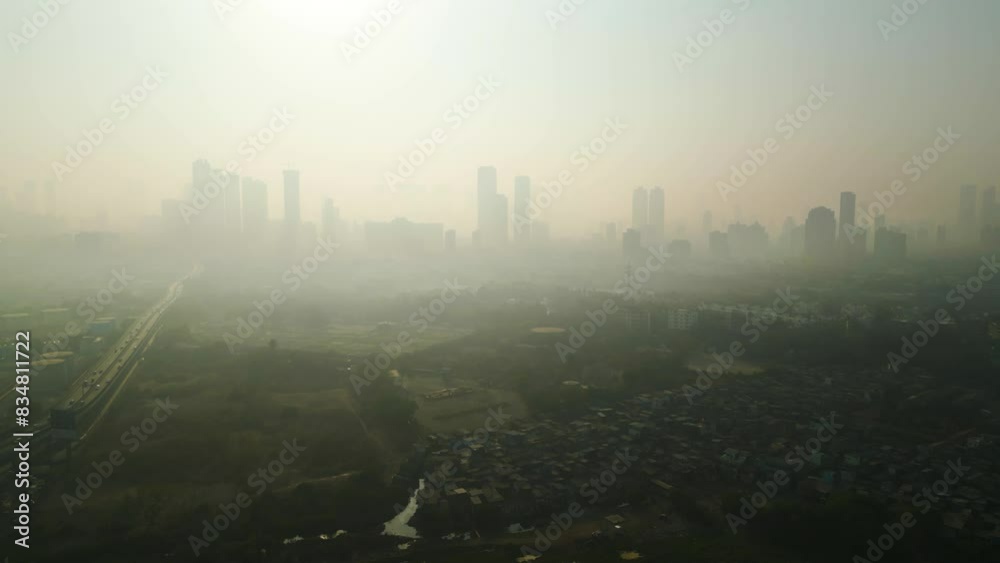 Mumbai skyline covered in smog, extreme air pollution India, drone flyover aerial establishment shot Mumbai skyline covered in smog, extreme air pollution India, drone flyover aerial establishment shot