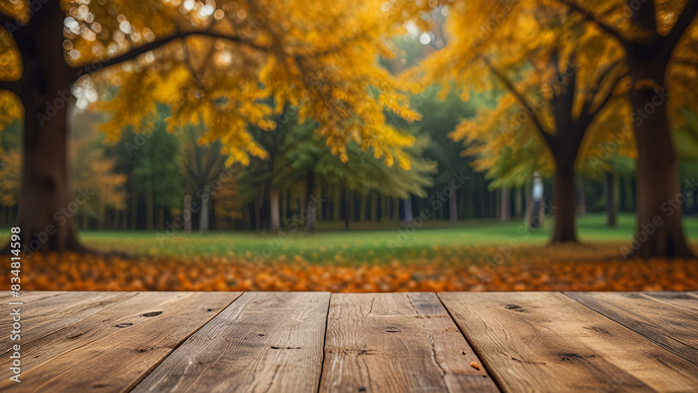 Empty wooden surface on blurred seasonal autumn background. Nature with view to park trees. Mock up with copy space. Template showcase scene for display, montage, advertising product. Empty wooden surface on blurred seasonal autumn background. Nature with view to park trees. Mock up with copy space. Template showcase scene for display, montage, advertising product.