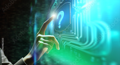 空中に出現した青緑の光るARのデジタルモニターのタッチパネルのクエスチョンマークのボタンを押す女性の手指　謎・不思議・テクノロジー・デジタル・スイッチ・はじまりの背景壁紙 photo