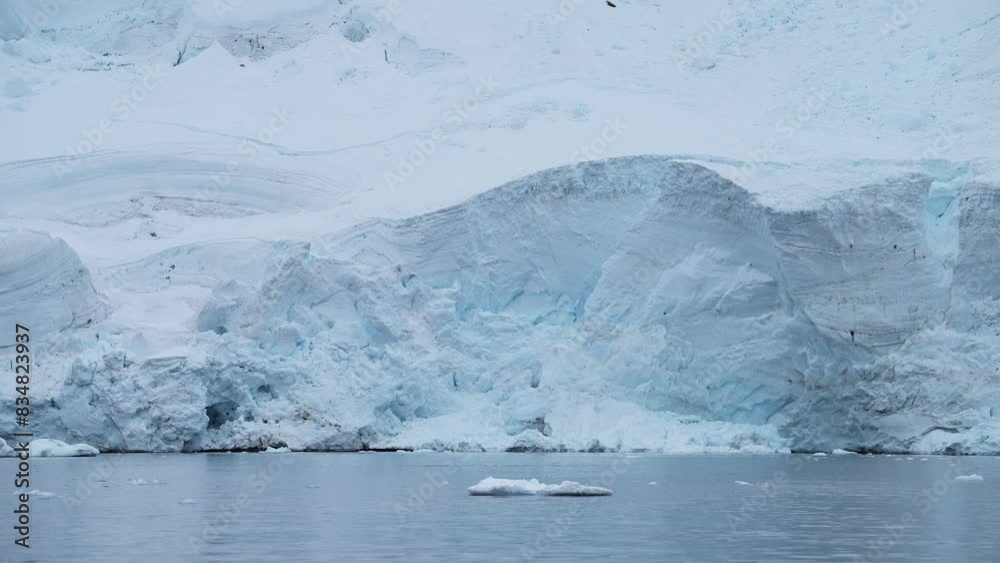 Glacier and Sea on Antarctica Coast, Ice and Coastal Winter Landscape, Icy Glacial Scenery with a Big Glacier Next to the Sea on the Antarctic Peninsula with a Crevass and Ice Formations Glacier and Sea on Antarctica Coast, Ice and Coastal Winter Landscape, Icy Glacial Scenery with a Big Glacier Next to the Sea on the Antarctic Peninsula with a Crevass and Ice Formations