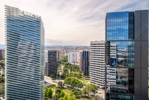 The juxtaposition of nature and urban development in Plaza Europa, Hospitalet de Llobregat, Catalonia, Spain, is evident in this city view