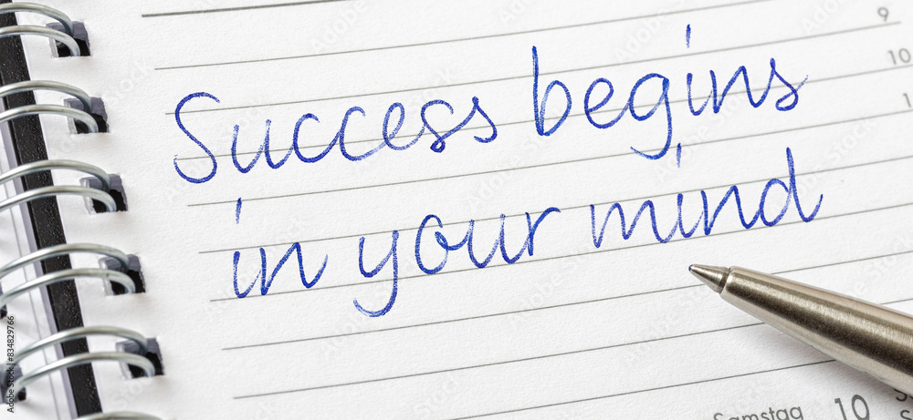 Success begins in your mind written on a calendar page Success begins in your mind written on a calendar page