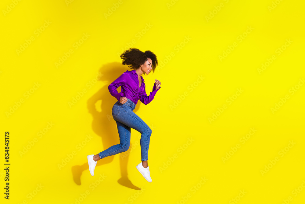 Full body photo of lovely young lady run hurry black friday dressed stylish violet garment isolated on yellow color background Full body photo of lovely young lady run hurry black friday dressed stylish violet garment isolated on yellow color background