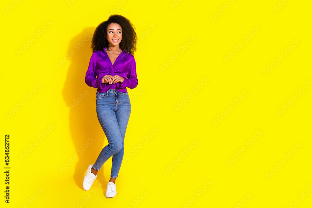Full body photo of lovely young lady cute posing look empty space dressed stylish violet garment isolated on yellow color background Full body photo of lovely young lady cute posing look empty space dressed stylish violet garment isolated on yellow color background