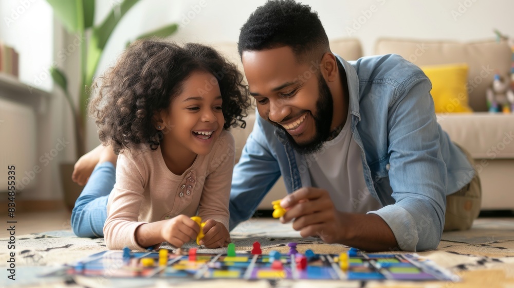 Family fun night, Father and daughter enjoying a board game. Family fun night, Father and daughter enjoying a board game.