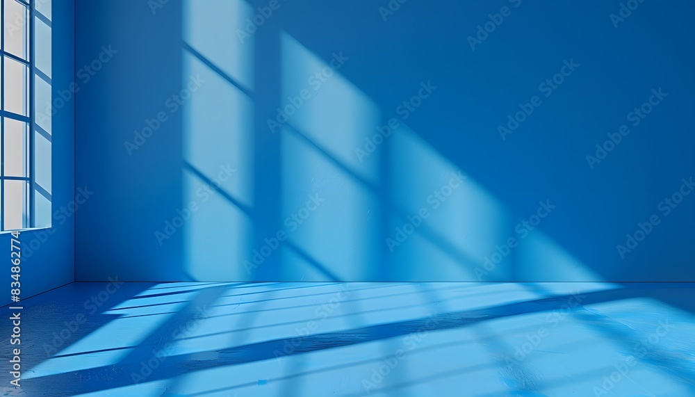 A blue background with the shadow of windows, light and shadows on the wall in a minimalist style A blue background with the shadow of windows, light and shadows on the wall in a minimalist style