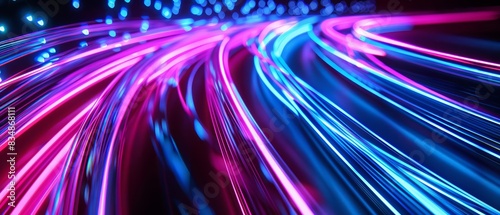 Neon pink and blue light trails converging and diverging on a dark background, symbolizing fast digital connections Closeup