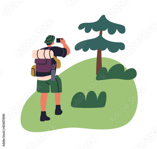 Hiker taking photo. Tourist hiking photographing nature with smartphone. Back...