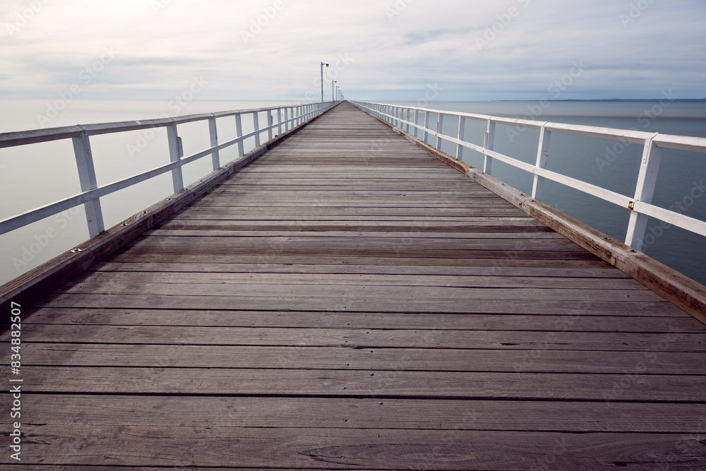 Fototapeta premium Urangan pier jetty, Hervey Bay, Queensland, Australia, timber tourist destination travel holiday vacation, empty no people, long exposure