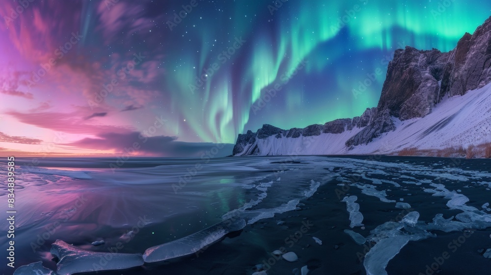 Fototapeta premium Beautiful landscape with snow mountain and aurora northern lights in night sky in winter.
