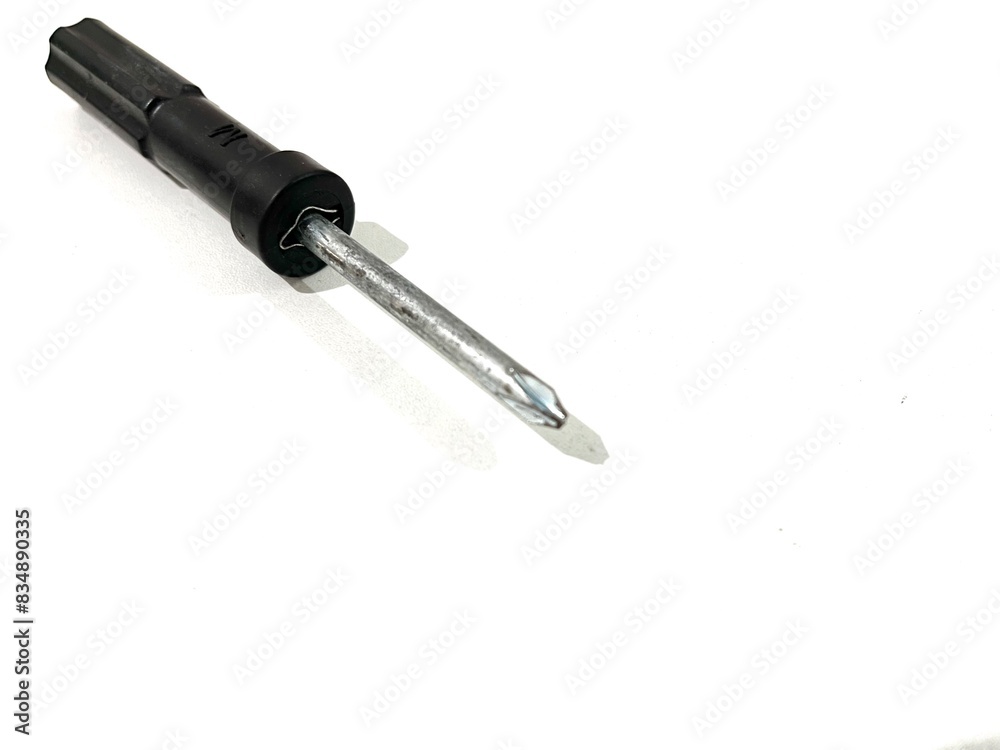 A single screwdriver with plastic black handle for repairing isolated on white background A single screwdriver with plastic black handle for repairing isolated on white background