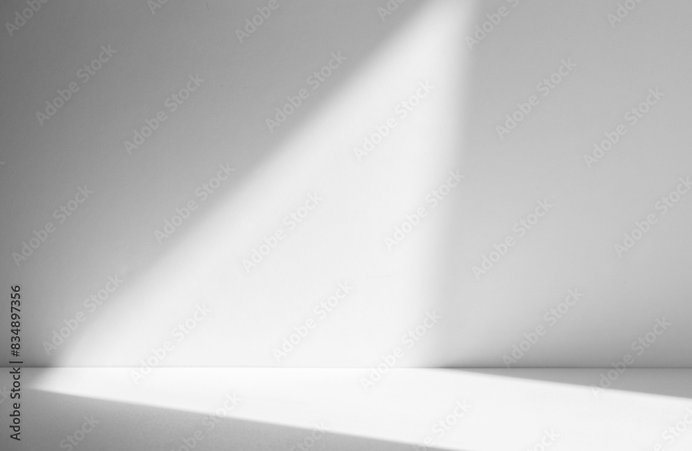 Wall interior background, studio and backdrops show products.with shadow from window color white and grey. background for text insertion and presentation product Wall interior background, studio and backdrops show products.with shadow from window color white and grey. background for text insertion and presentation product