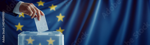 Person voting in European Election with EU flag background. Long banner with copy space © LiliGraphie
