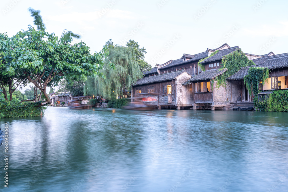 Discover China Wuzhen's ancient architecture, where old stone paths and bridges reflect on peaceful waters. Experience the charm of historic buildings along serene rivers.. Discover China Wuzhen's ancient architecture, where old stone paths and bridges reflect on peaceful waters. Experience the charm of historic buildings along serene rivers..