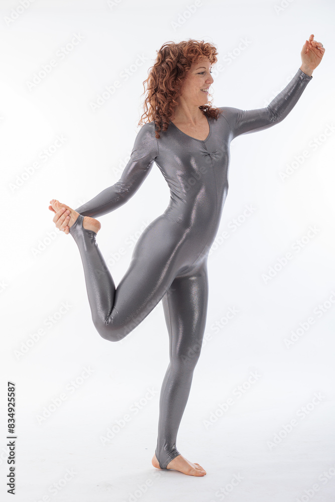 Obraz premium Peaceful yoga practice in the studio on white background with a beautiful woman