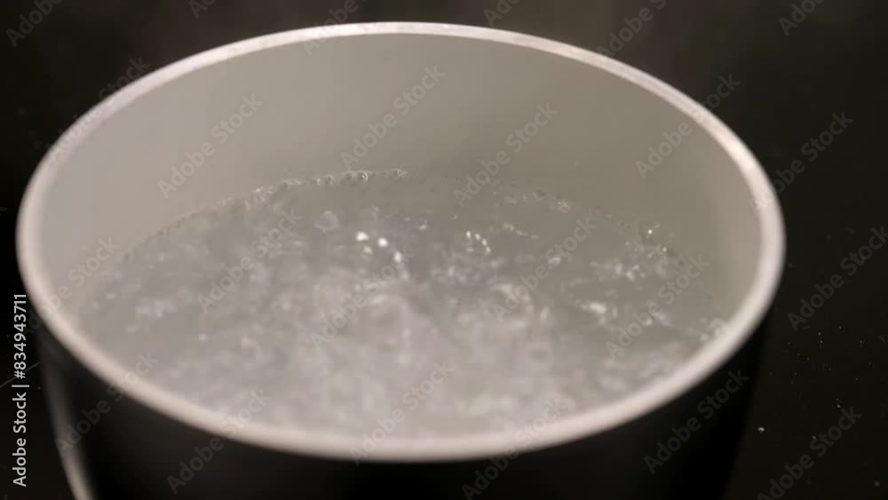 the water is boiling and the cook is ready to throw in the pasta
