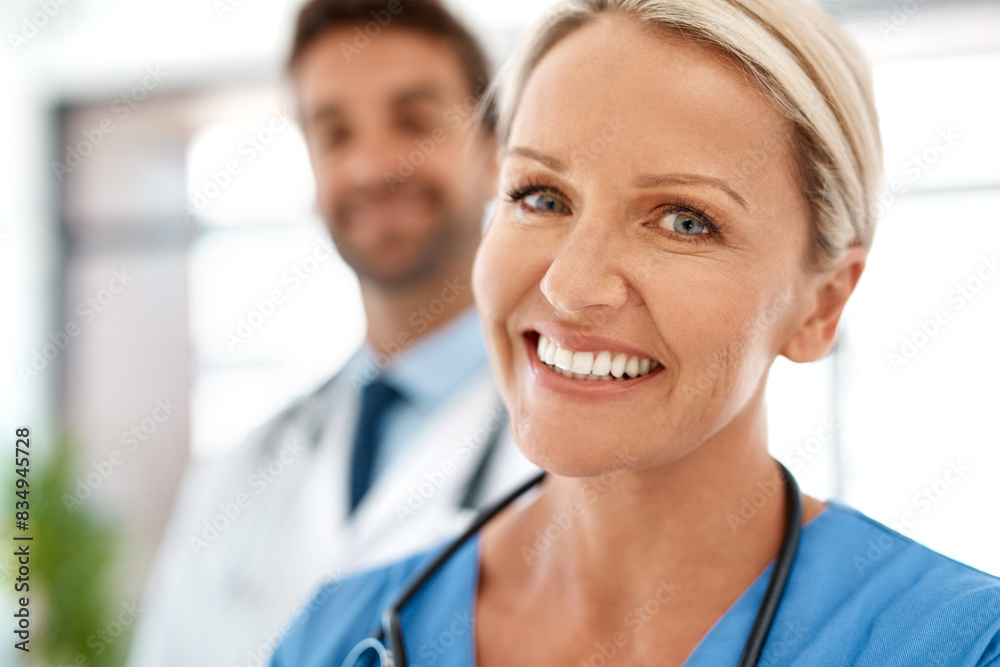 Portrait, woman and happy nurse in clinic for healthcare service, coworking or medicine with team. Face, medical professional and expert surgeon, employee and physician working at wellness hospital Portrait, woman and happy nurse in clinic for healthcare service, coworking or medicine with team. Face, medical professional and expert surgeon, employee and physician working at wellness hospital