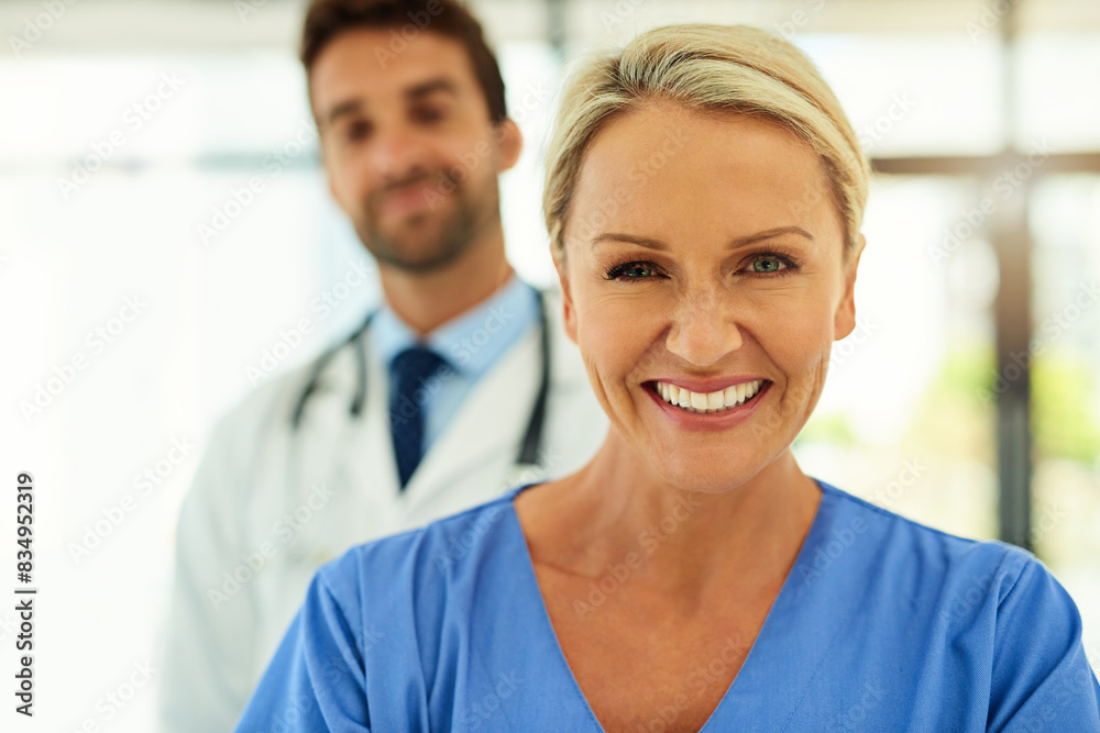 Portrait, woman and happy nurse in hospital for healthcare service, coworking or medicine. Face, medical professional and expert surgeon, employee and physician working at wellness clinic with team