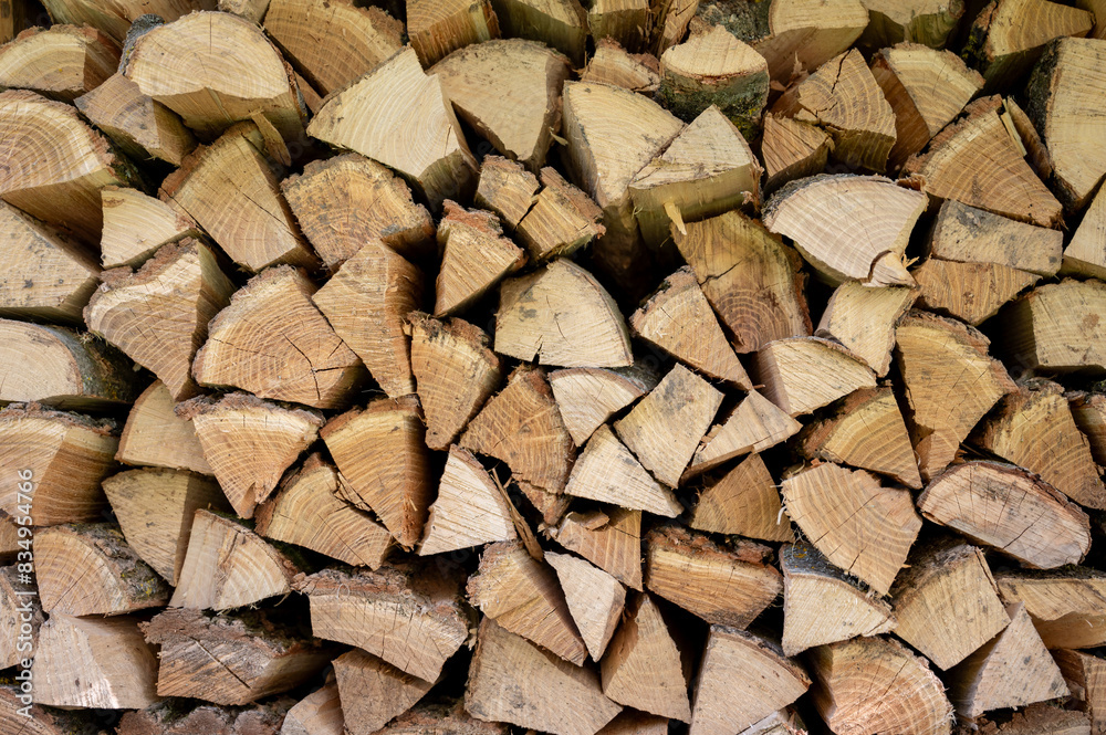 Pile of chopped firewood prepared for winter. Firewood background. Pile of chopped firewood prepared for winter. Firewood background.