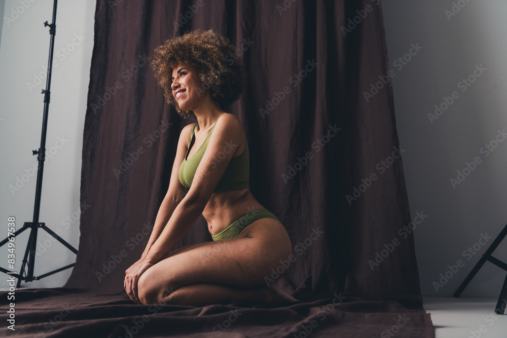 Full size photo of lovely young lady sit seduce knees dressed khaki lingerie studio background no filter self acceptance all body perfect Full size photo of lovely young lady sit seduce knees dressed khaki lingerie studio background no filter self acceptance all body perfect