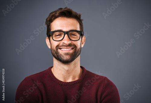 Studio, glasses and man with smile, face and wellness with eye care, product and lens for vision. Grey background, portrait and happiness for person, prescription and eyewear with fashion in USA