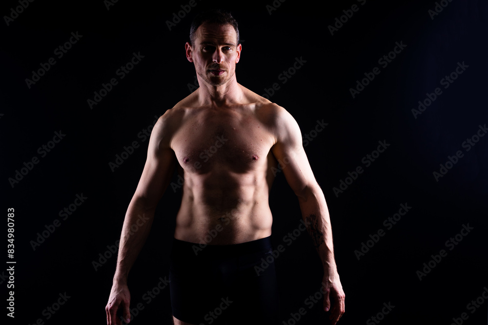 Portrait of man, bodybuilder and bicep flex in studio, background and exercise for muscular power. Portrait of man, bodybuilder and bicep flex in studio, background and exercise for muscular power.