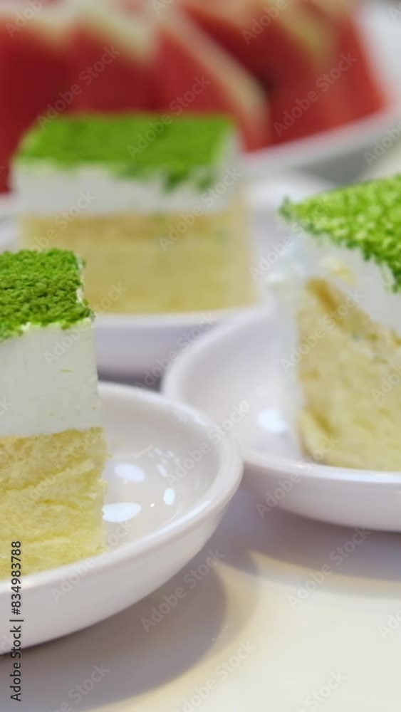 pistachio sponge cake at the buffet table sprinkled with green freeze-dried pistachio berries pistachio sponge cake at the buffet table sprinkled with green freeze-dried pistachio berries