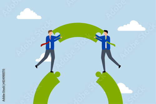 Business teamwork and partnership help to achieve team success, business people working on team building connect puzzle bridge.