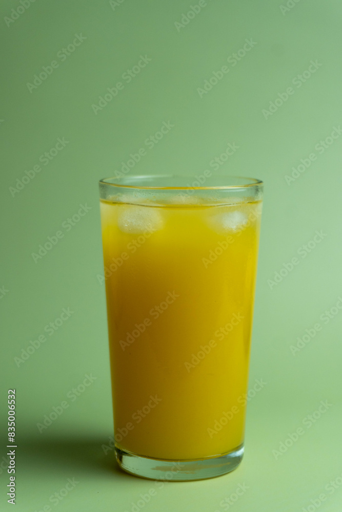 Ripe Mango Juice with Green Background