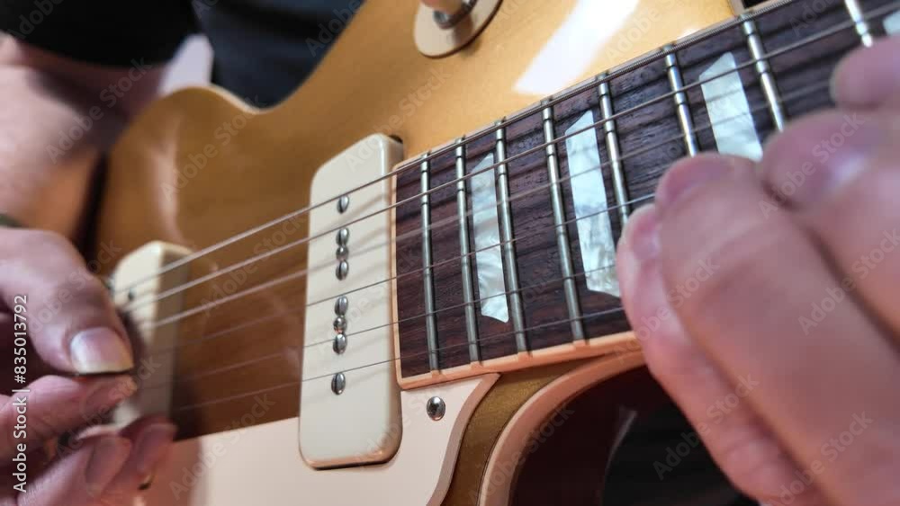 close up footage of musician playing electric guitar