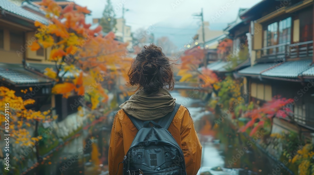 Fototapeta premium Experience the charm of Kyoto city through stunning visuals of an Asian female tourist exploring its timeless beauty on foot