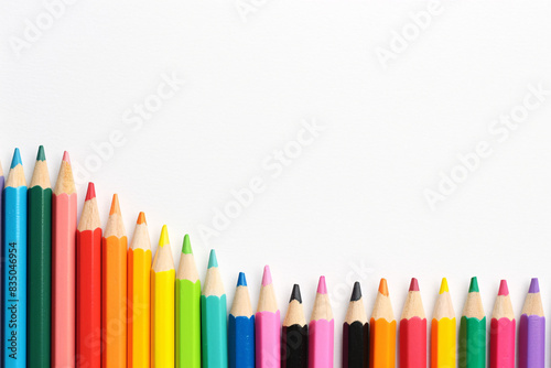 Colorful pencils arranged in ascending order with the tallest on the left creating a gradient effect