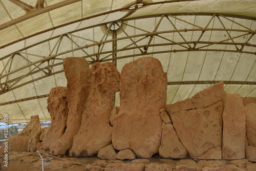 HAGAR QIM, MALTA -AUGUST 06, 2021  - neolithic temples of HAGAR QIM. Under a large canopy on a hot summers day next to the Mediterranean Sea. photo