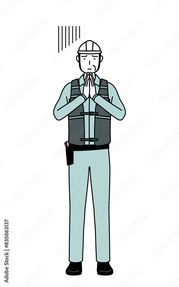 Senior male engineer in helmet and work wear apologizing with his hands in front of his body. Senior male engineer in helmet and work wear apologizing with his hands in front of his body.