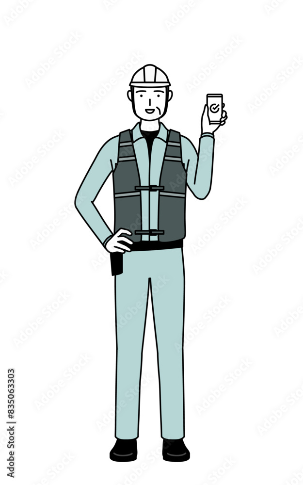 Senior male engineer in helmet and work wear using a smartphone at work. Senior male engineer in helmet and work wear using a smartphone at work.