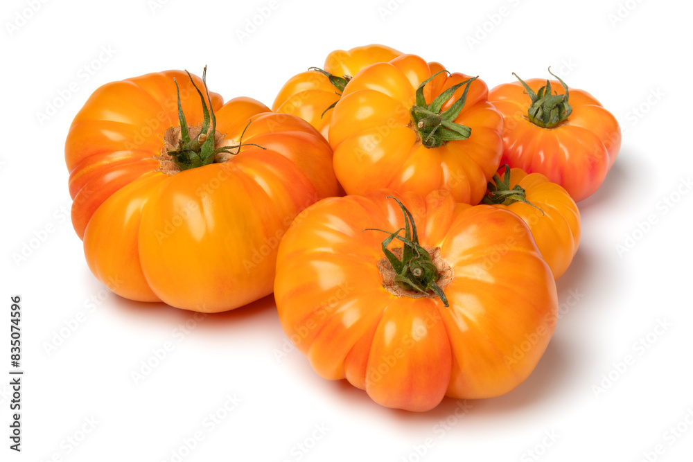 Heap of fresh whole juicy orange tomatoes isolated on white background close up Heap of fresh whole juicy orange tomatoes isolated on white background close up