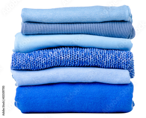 Stack folded blue sweaters on white background isolation