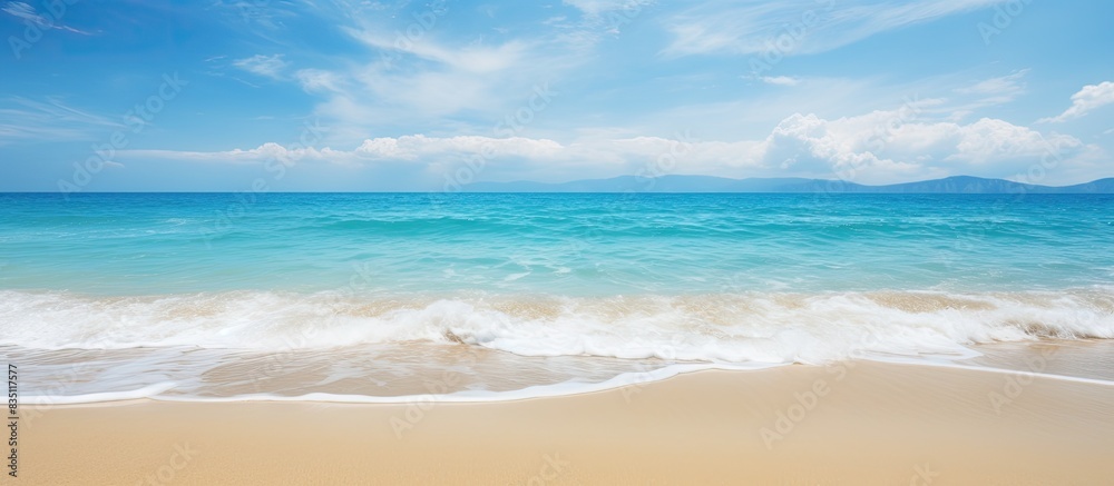 Gorgeous beach with golden sand where the waves gently roll in, perfect for a relaxing day with a copy space image. Gorgeous beach with golden sand where the waves gently roll in, perfect for a relaxing day with a copy space image.