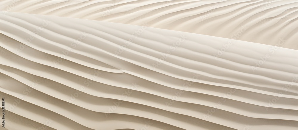 Obraz premium Zempin beach features undisturbed sand with delicate wind patterns forming grooves in the fine grains, creating a serene copy space image.