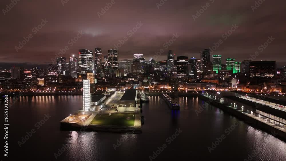 Flight along the Montreal Skyline at night with beautiful city lights of Montreal - MONTREAL, CANADA NORTH AMERICA - APRIL 20, 2024 Flight along the Montreal Skyline at night with beautiful city lights of Montreal - MONTREAL, CANADA NORTH AMERICA - APRIL 20, 2024