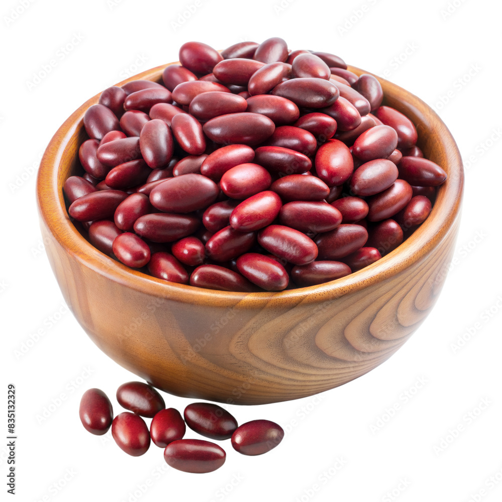 A wooden bowl filled with fresh red kidney beans, with some beans on the surface near the bowl A wooden bowl filled with fresh red kidney beans, with some beans on the surface near the bowl