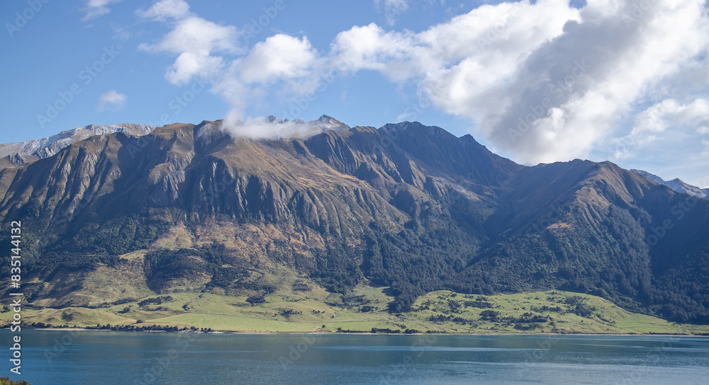Mountain and lake scenic view of Lake Wanaka, New Zealand, South Island. Mountain and lake scenic view of Lake Wanaka, New Zealand, South Island.