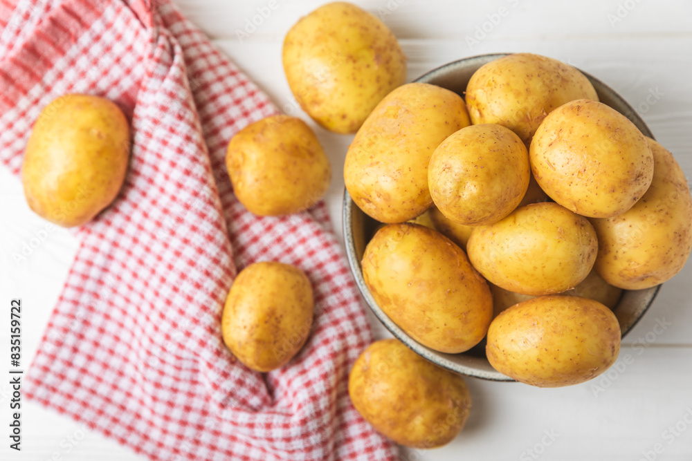 Young potatoes. Fresh potatoes on a wooden background.Harvesting collection. organic, freshly dug potatoes. Agricultural background. Vegan. Vegetables.Place for text.Copy space Young potatoes. Fresh potatoes on a wooden background.Harvesting collection. organic, freshly dug potatoes. Agricultural background. Vegan. Vegetables.Place for text.Copy space