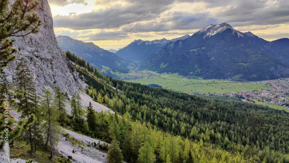 Fototapeta premium Alpine mountain landscape in spring with forest 