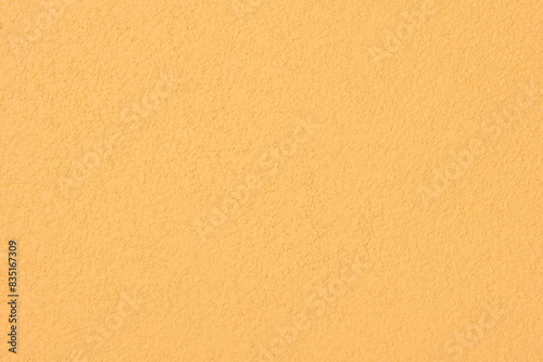Yellow cement wall texture for background.
