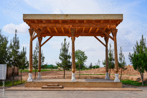Traditional wooden pergola next to the Sultan Saodat Mausoleum on the outskirts of Termez in the Surxondaryo Region, southern Uzbekistan, Central Asia photo